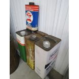 Three one gallon oil cans, Mobil, Castrol,