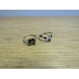 A 9ct gold sapphire and diamond wishbone ring size L/M and a 9ct gold ring set with square green
