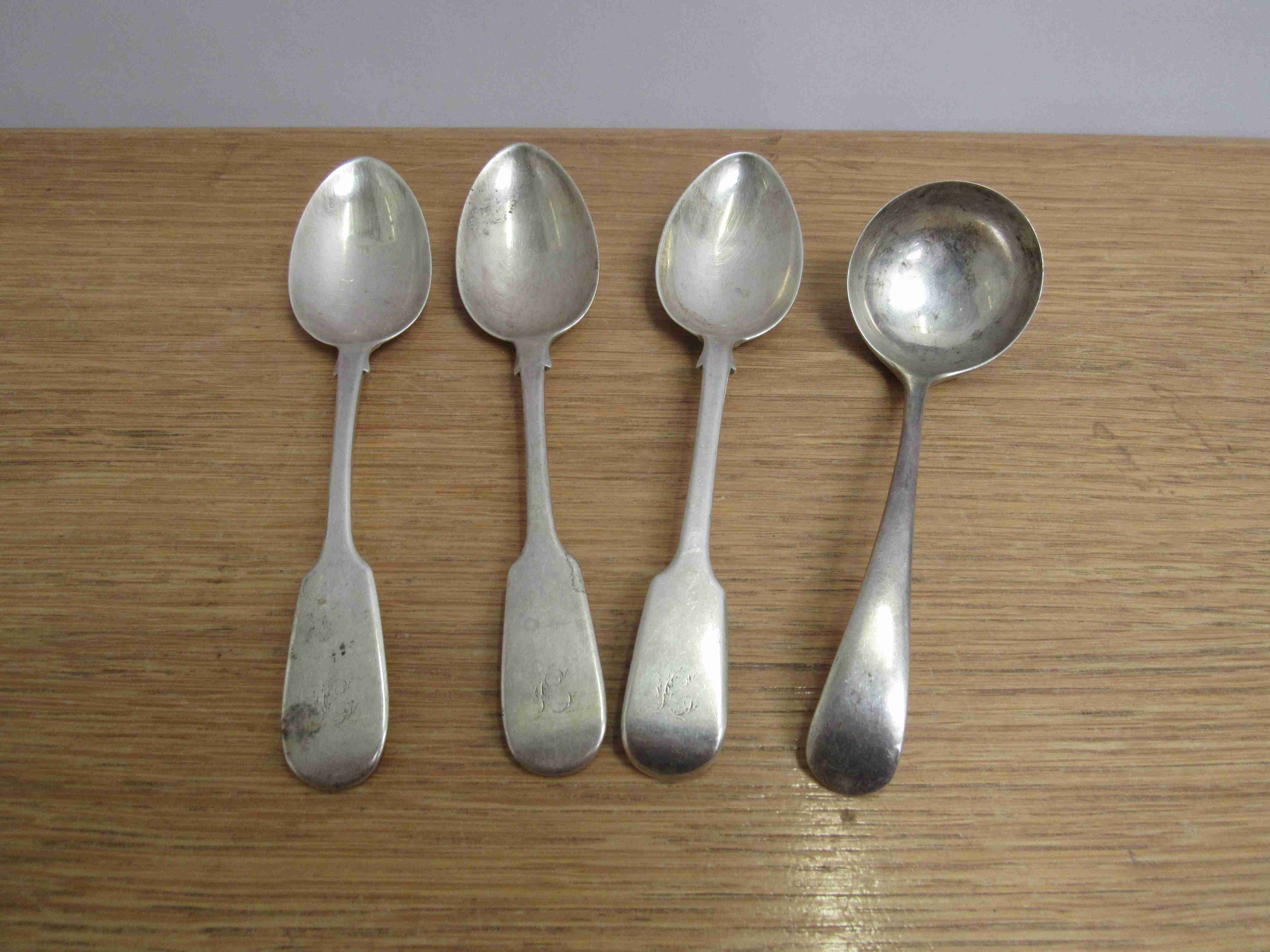 Three Victorian silver spoons and a ladle various makers and dates including Benjamin Stephens &