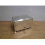 An S Blanckensee & Son Ltd silver table cigarette box with engine-turned decoration to the hinged