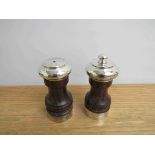 A Da-mar silverware pair of salt and pepper grinders, hardwood centres, one knop missing, 10.
