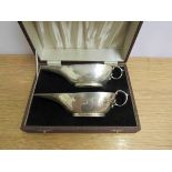 A cased pair of S Blanckensee and Son Ltd silver sauce boats,