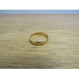 A 22ct gold wedding band, size W, 4.