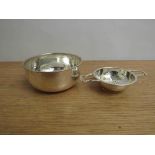 A Barker Brothers Silver Ltd silver tea strainer with shaped handles, Birmingham 1956.