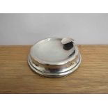 A silver ashtray, weighted base, marks rubbed,