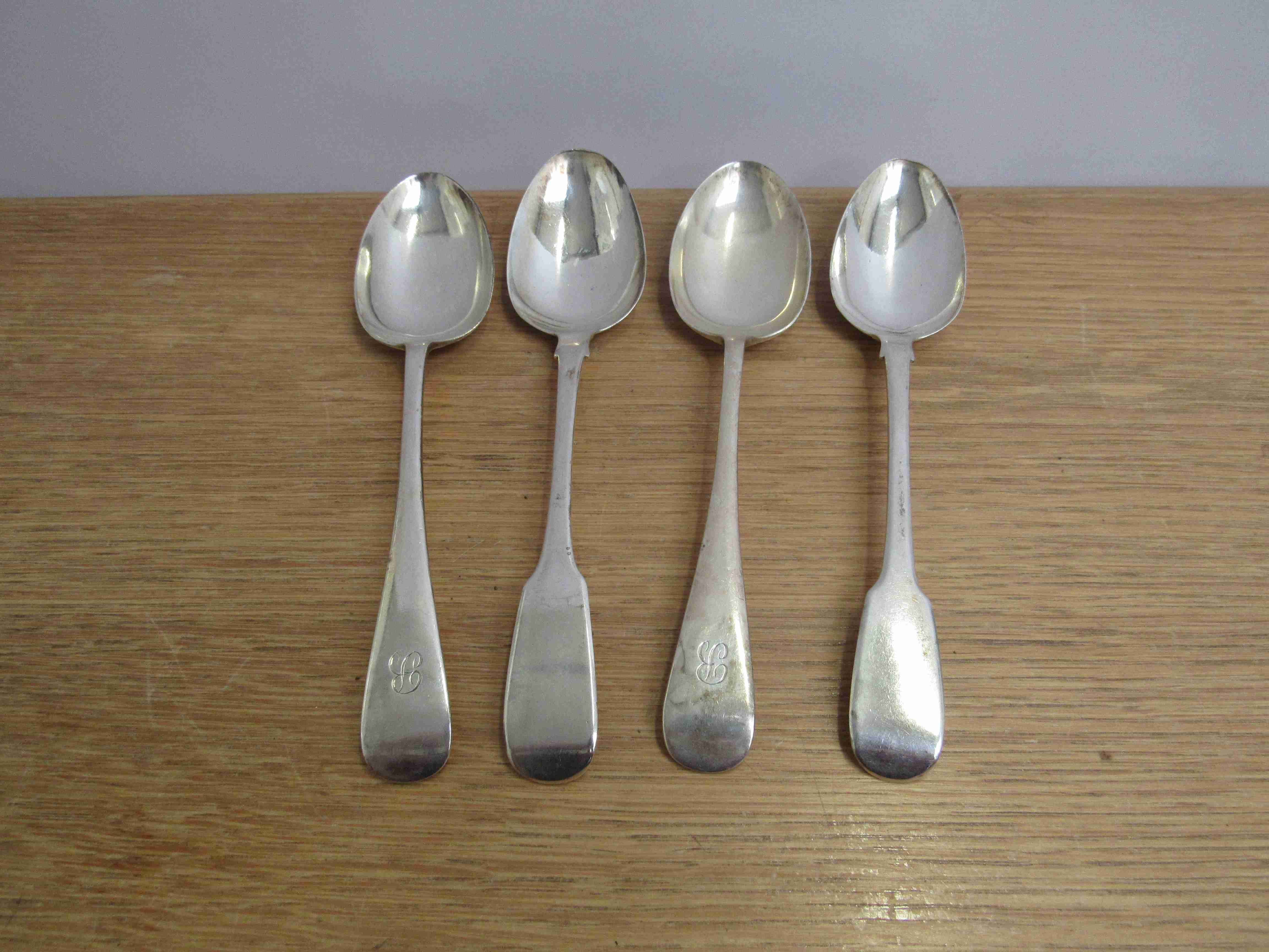 Four silver serving spoons two by Cooper Brothers & Sons Sheffield 1919 with monogrammed handles,