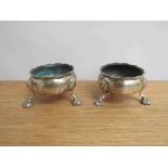 A pair of George III Daniel Hockley silver salts raised on three feet, London 1762,