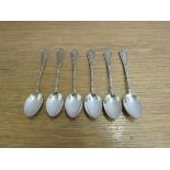 Six ornate white metal teaspoons