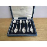 A Walker & Hall silver set of six coffee spoons with pierced foliate terminals, Sheffield 1953,