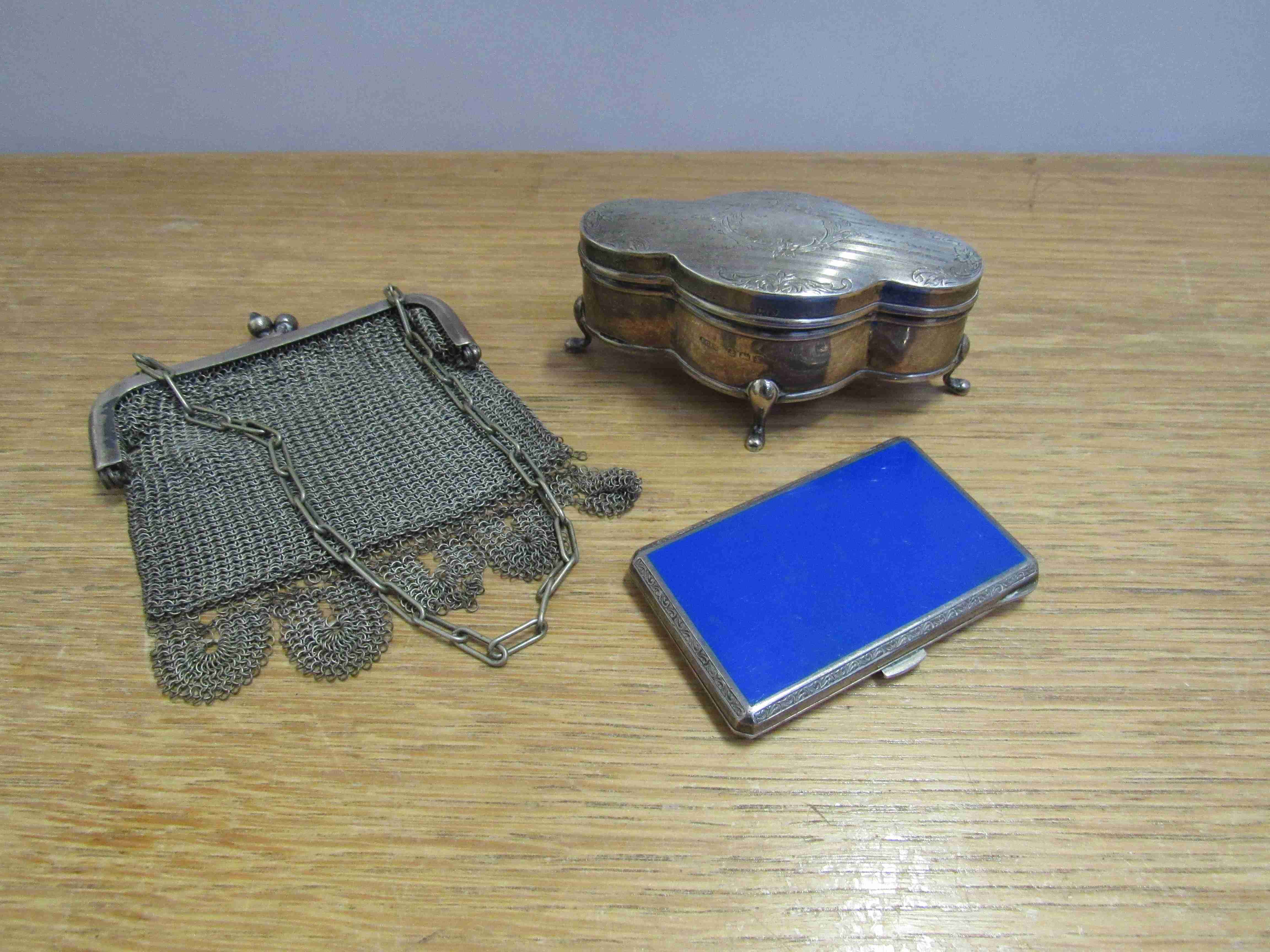 A silver ring box, 10cm long, silver and enamel lady's cigarette case,