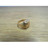 A gold signet ring with single red stone, worn, size T/U, 6.