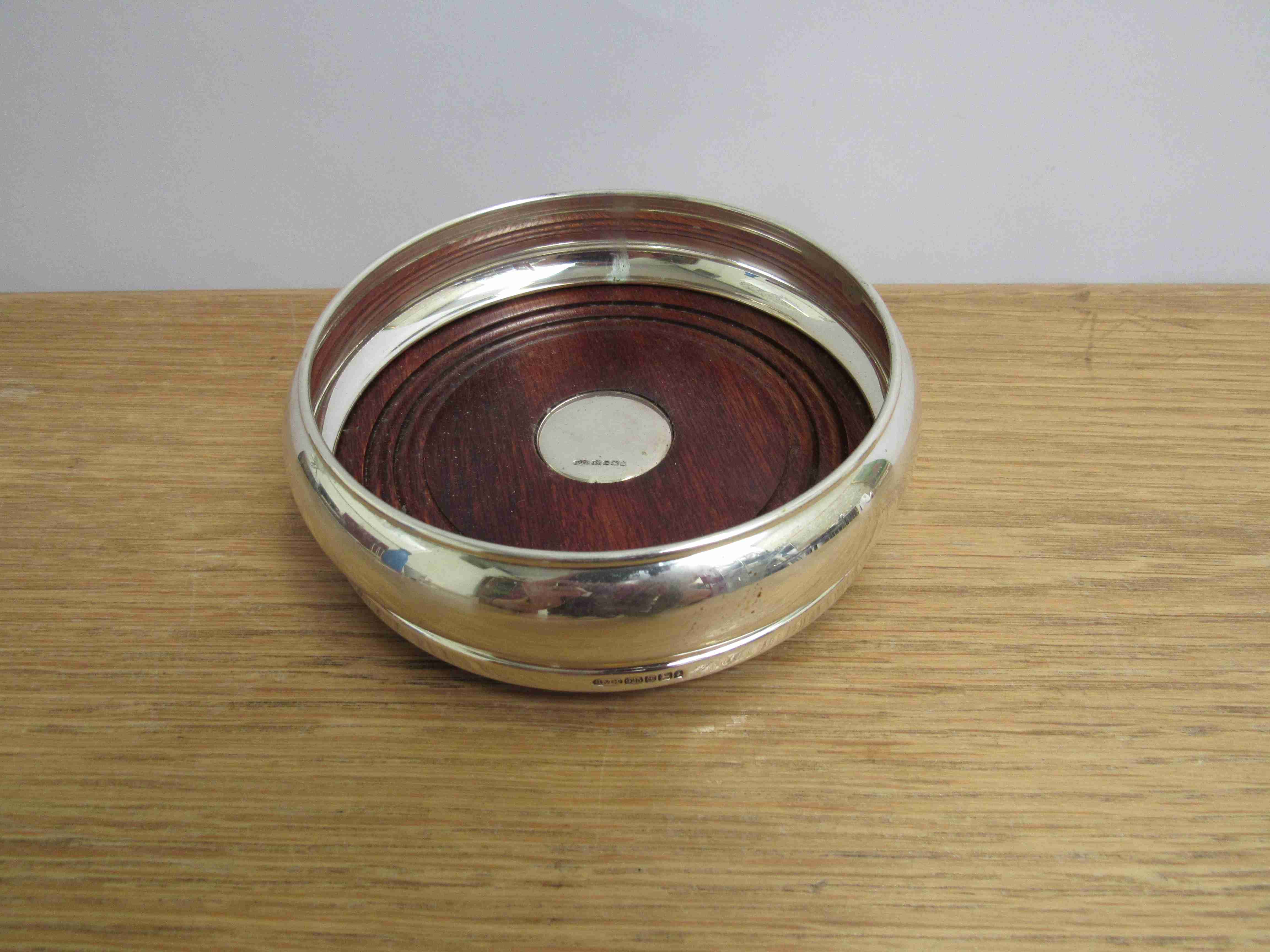 A W.I Broadway & Co silver and turned hardwood wine bottle coaster, Birmingham, 2002 13.