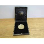 A Cartier Commemorative coin/medalion Derby 1985, slip Anchor with anchor motif,