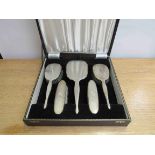 An Adie Brothers Ltd silver six piece brush and mirror set in case,