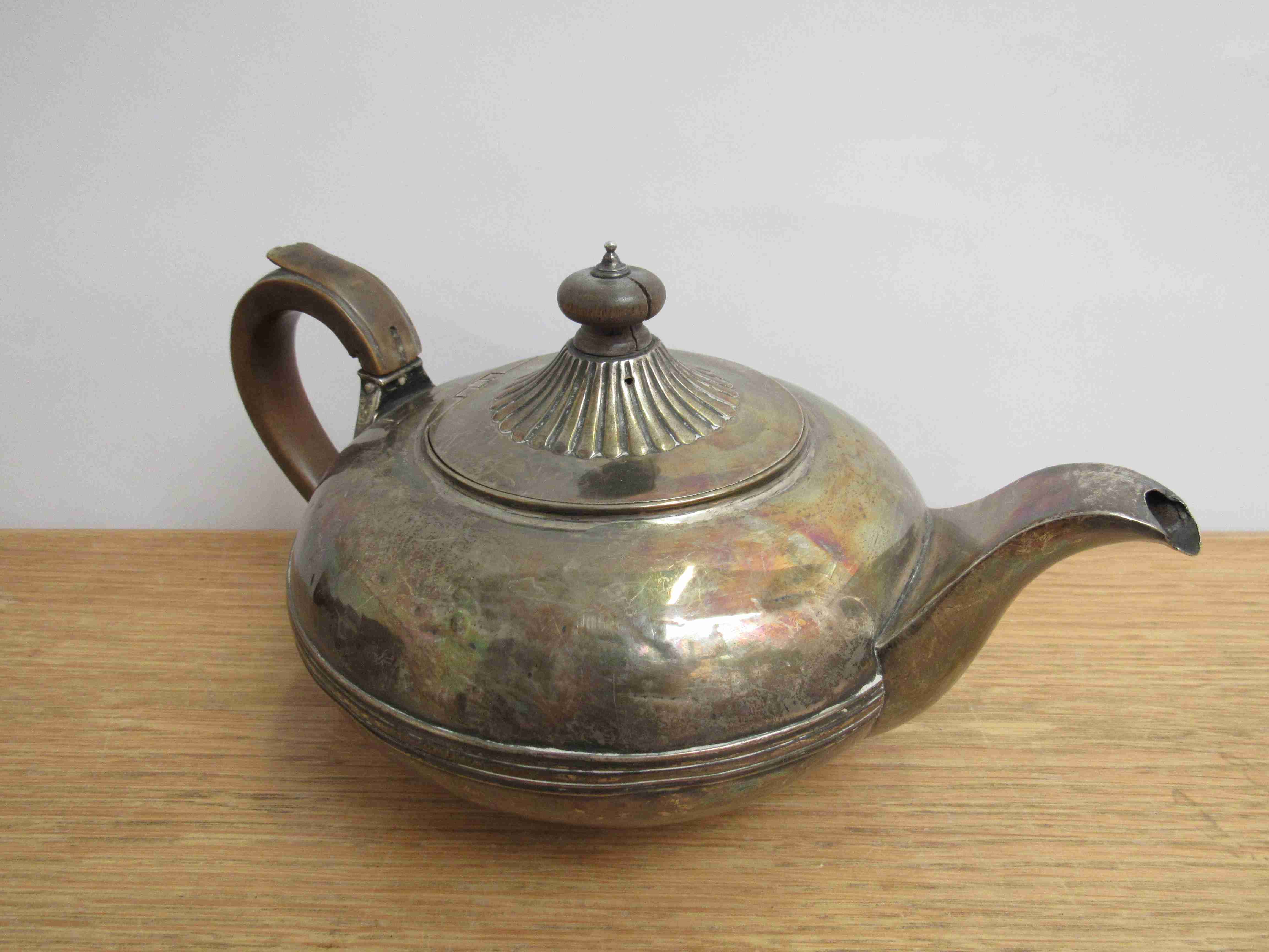 A Georgian silver teapot with treen finial and handle marks rubbed, dented, - Image 2 of 4