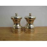A pair of Lawrence R Watson & Co silver salt and pepper grinders,