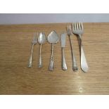 Mixed silver flatware including trident fork, butter knife,
