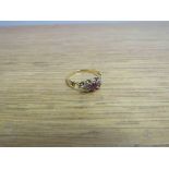 A diamond and ruby gold ring