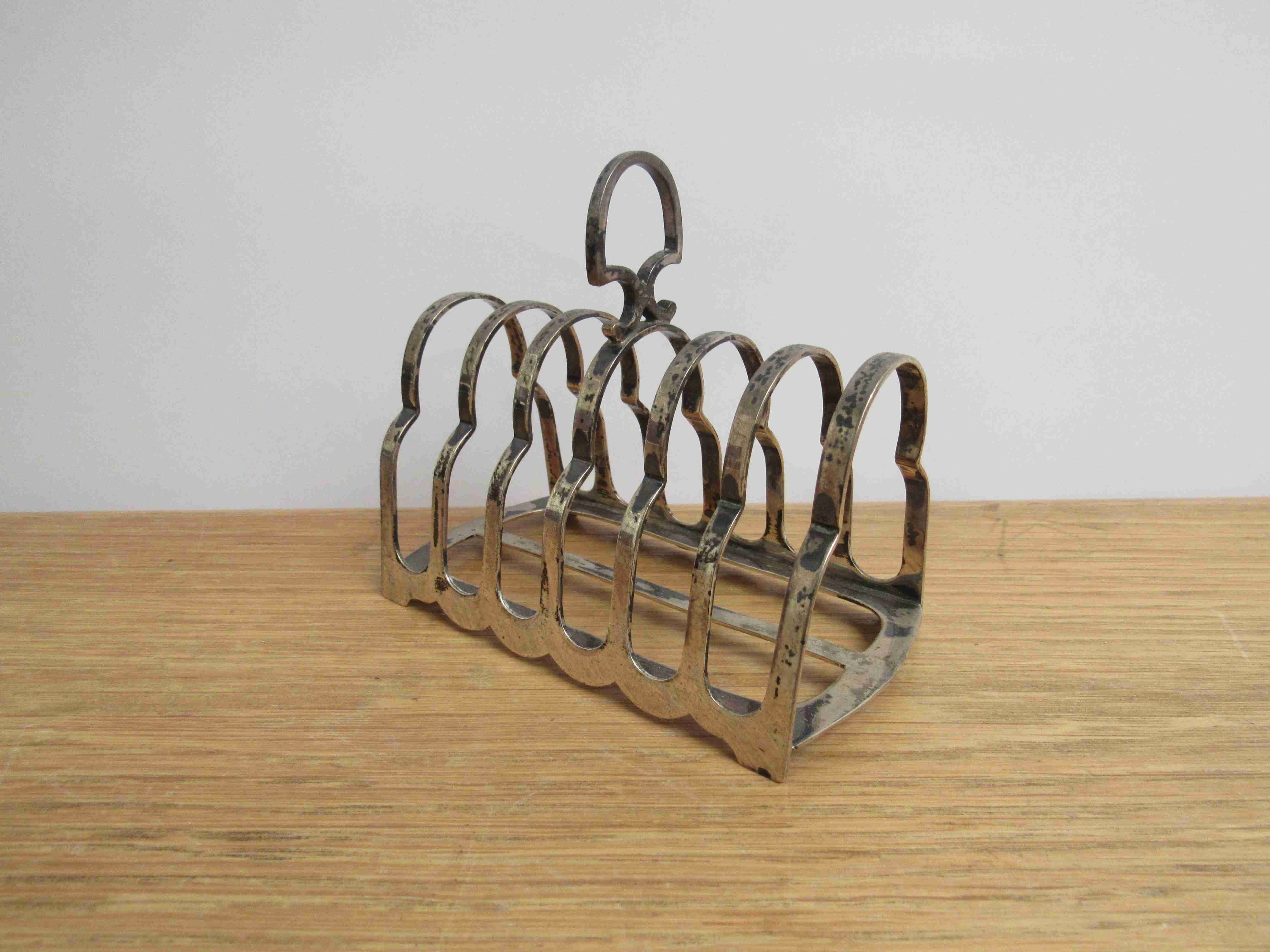 A Harrison Brothers & Howsen silver 7-bar toast rack, 11.