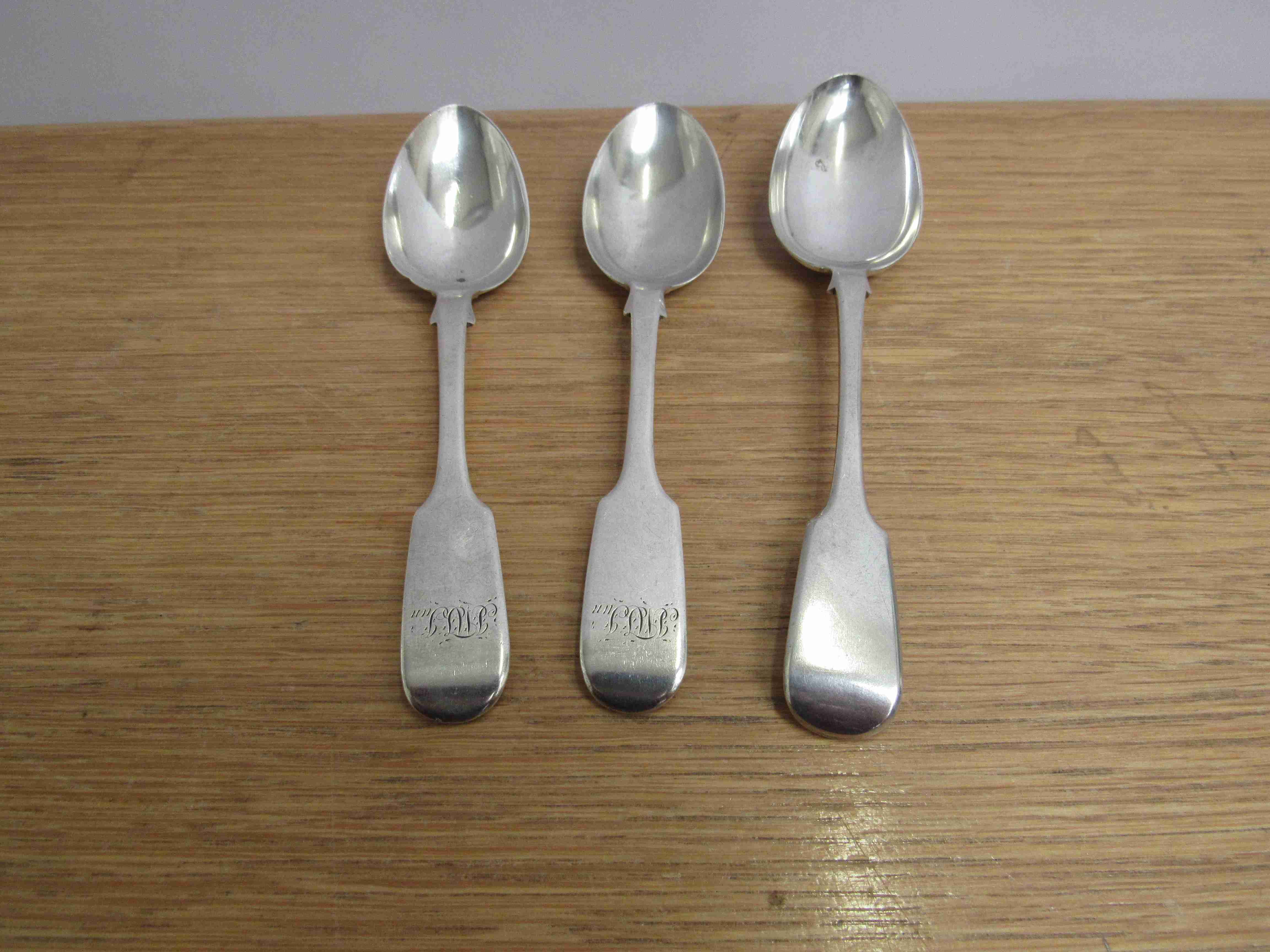 Three silver spoons including a pair by Robert Williams, Exeter 1845, monogrammed,