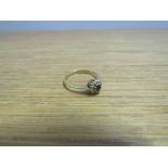 An 18ct gold diamond and sapphire daisy ring, size M/N, 2.