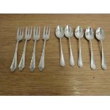 Four silver cake forks and five silver rat tail teaspoons Birmingham 1928 & 1915,