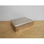 A silver cigarette box of plain form with engine - turned lid, Birmingham 1911, 3.