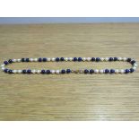 A Lapis Lazuli, pearl and gold bead necklace with 9ct gold clasp,