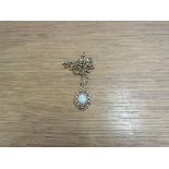 A 9ct gold necklace hung with gold pendant set with a single opal, 46cm long, 7.
