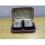 A pair of James Dixon and Sons Ltd silver napkin rings in case, Sheffield 1930,