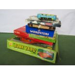 A collection of mixed board games including The Junkyard Game,