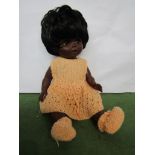 A mid 20th Century Chiltern black plastic girl doll