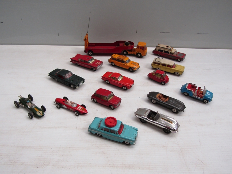 A collection of played with Corgi diecast vehicles icluding Carrimore Low Loader, Heinkel,