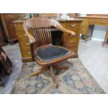 An Edwardian tub swivel office chair with leather seat, stud detail.