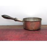 A 19th Century French silver saucepan with treen handle and crested detail, with Paris mark to base,