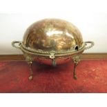 A silver-plate Alexandre Clark swivel top breakfast dish/warmer, 38cm long.