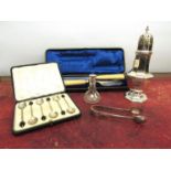 A set of silver coffee bean spoons, cased serving knife and fork,