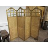 An Edwardian French four-fold screen with silk panels, one glass pane missing, worn condition,