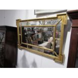A highly ornate 19th Century gilt cushion mirror with egg and dart border,