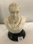 A heavy marble bust of a bearded man.