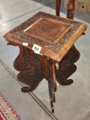 A Burmese carved table.