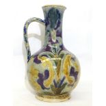 An 1875 Doulton Lambeth jug in attractive muted colour on a patterned bluey grey ground by Arthur
