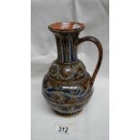 A Doulton Lambeth 1874 jug. Well patterned in blues, whites and browns with raised dots.