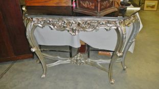 A silver coloured console table