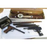 2 vintage gun cleaning kits, 2 air pistols, ramrods etc.