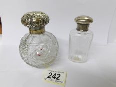 2 silver topped scent bottles.