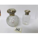 2 silver topped scent bottles.