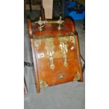 A 19th century brass mounted oak coal box with shovel but missing liner.