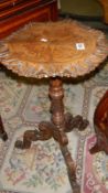 A 19th century carved mahogany tripod table