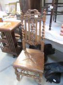 A carved oak hall chair.